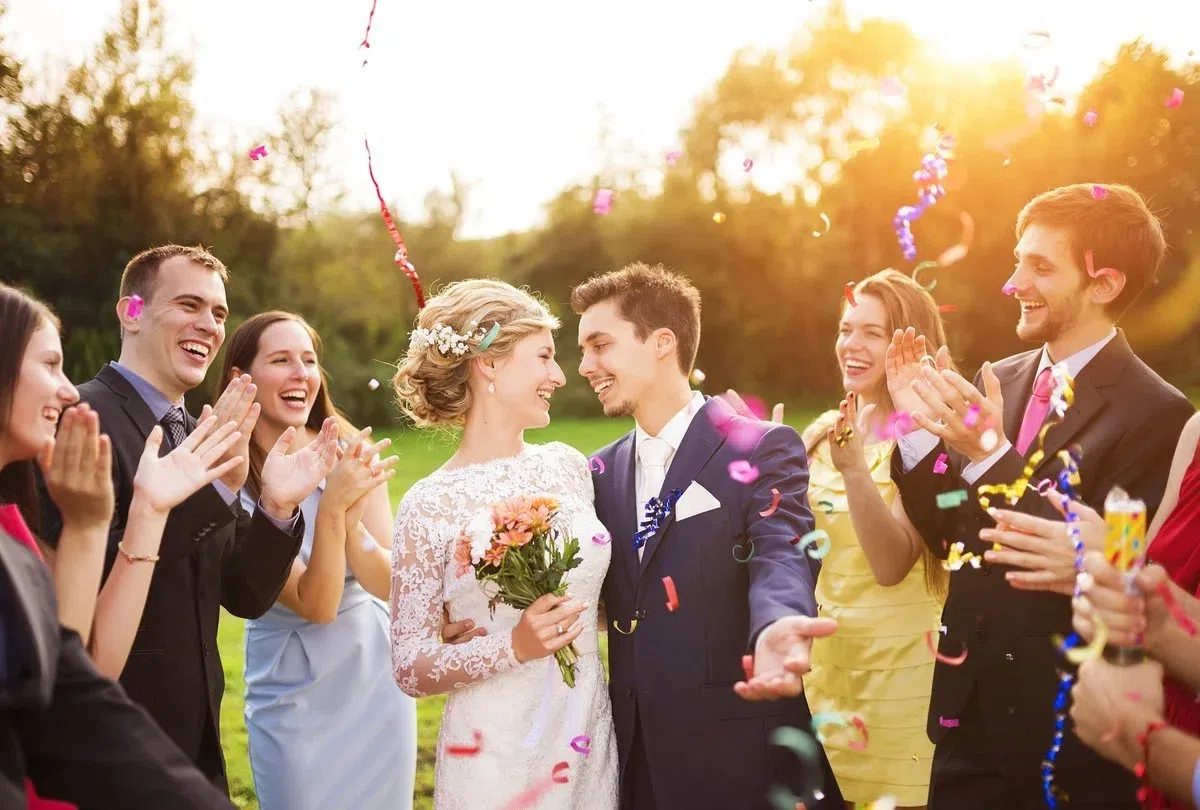 Wedding couple and their are claping ina wedding